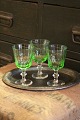 Gammelt Chr.d.8 hvidvinsglas med fin grøn farve fra Holmegård glasværk.
H:13cm. Dia.:7cm.