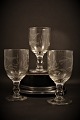 Old French mouth blown wine glass with cut leaf decorations. 
H: 14cm. Dia.:7cm.
SOLD !