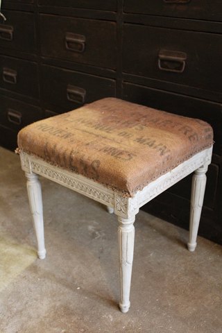 1800 Century Stool in wood with fine gray color, covered with rough linen 
fabrics.