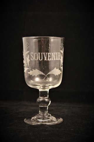 Old French souvenir wine glass with engraved writing and decorations. 
"Souvenir"