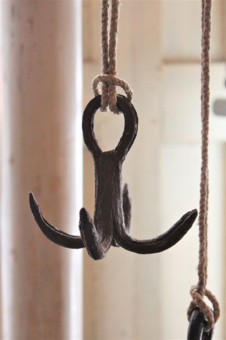1800 Century wild hook in wrought iron, super decorative  to hang old cookware or garlic bunches on.Is fitted with an old strong rope so it