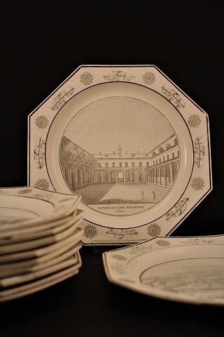 French 1800 century , 8 edged lunch plates with pearl edge in cream colored 
pipes with motifs of famous buildings and places in Paris.