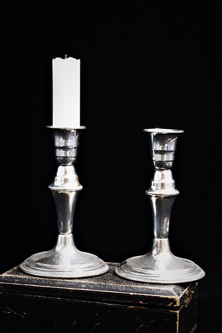 A pair of old candlesticks in silver, stamped...