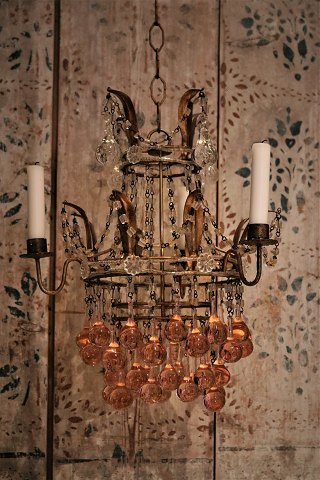 Old French chandelier in gilded metal, decorated with glass chains and glass balls in clear and pink colours...