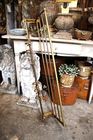 Old coat rack with hat shelf in brass...