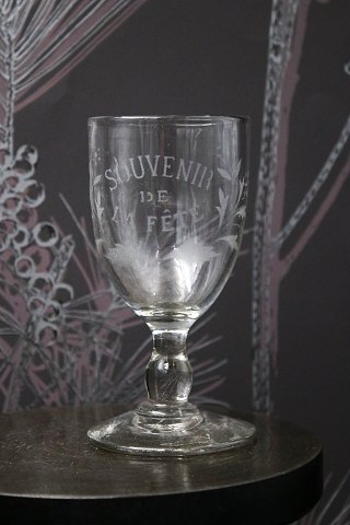 Old French souvenir wine glass with engraved writing and decorations. "Souvenir 
de la feté"