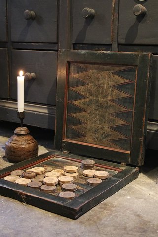 Charming antique 19th century game box / board game in painted wood with 3 
different games. Has a super nice patina.