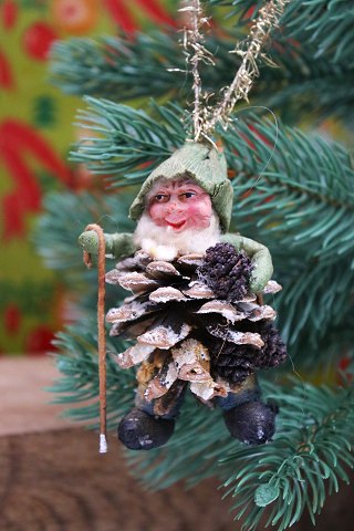 Old Christmas tree ornament in the shape of a gnome with a stick and backpack...
