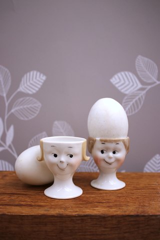 Old egg cups from the 30s in porcelain with painted funny faces...