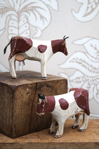 Decorative, old dairy cow in carved wood with fine original painting, ears and tail in leather...