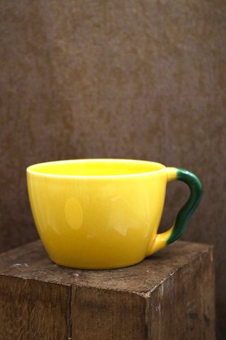 Ursula teacup in faience from Royal Copenhagen designed by Ursula Munch-Petersen in yellow glaze...