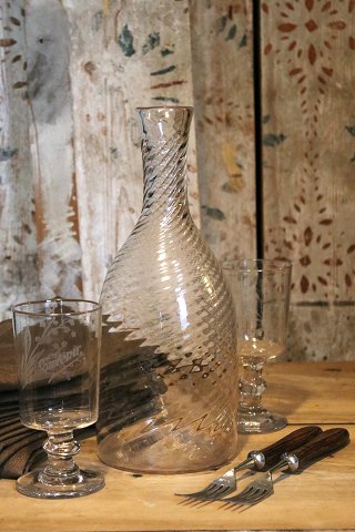 Antique, 19th century Swedish carafe in twisted mouth-blown glass. H: 28.5cm.