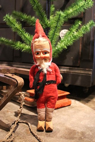 Nice, old Santa Claus with a body made of felt filled with straw, wooden shoes and a painted face in papier-mâché...