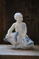 Very rare blue fluted figure of boy sitting on the fish ,from Royal Copenhagen.Factory 1st quality.