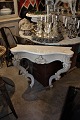Swedish 1900 Century console with curved legs, decorative carvings and white marble on top.