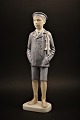 Rare porcelain figurine from Bing & Grondahl 
(year 1915) 
of boy with skates. H:29,5cm....