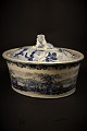 Antique oval, Swedish 1800 century Rørstrand pate terrine in faience with blue glaze with landscape motifs and lying lion on top of the lid.