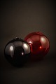 Decorative glass ball from Holmegaard glassworks In 
Red, Dia.:15cm.
Dark Purple, Dia.13cm.
