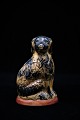 Old Swedish piggy bank in the form of a dog in painted ceramic with a fine patina. Height:13cm.