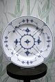 Royal Copenhagen Musselmalet Riflet lille middagstallerken.
RC# 1/176...