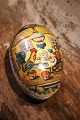 Old vintage Easter egg in papier-mâché with a motif of an Easter bunny and a chicken drinking tea together...