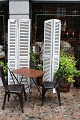 A pair of decorative old French shutters with original light grey patinated colour with slats...