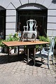 Antique 19th century Swedish folding table with base in blue patinated color and top in raw wood...