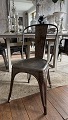 Original French Tolix cafe chair in metal, designed by Xavier Pouchard in 1934.
