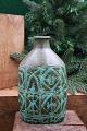 Kgl. oval faience Baca vase designed by Nils Thorsson from Aluminia with green / black pattern...