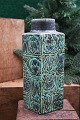 Royal 4 cornered faience Baca vase designed by Nils Thorsson from Aluminia with green / black pattern...